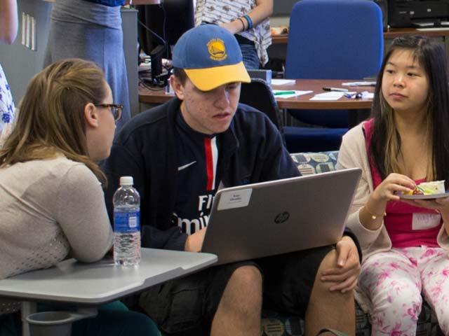 students using a laptop